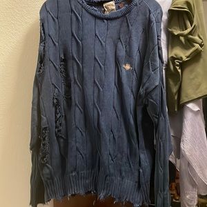 navy blue distressed sweater with sparkly stars on elbows.